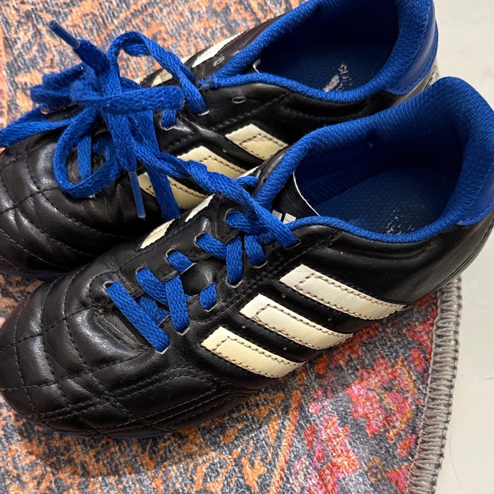 Adidas Black Cleats with Blue Highlights